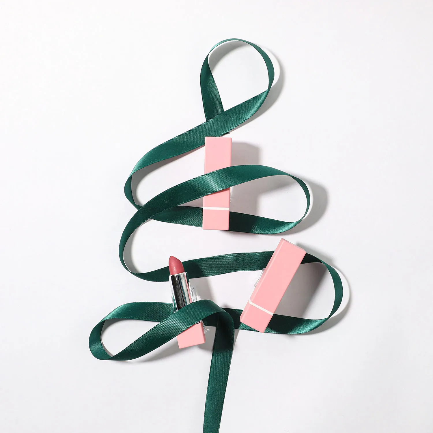 a full body model holding a black backpack